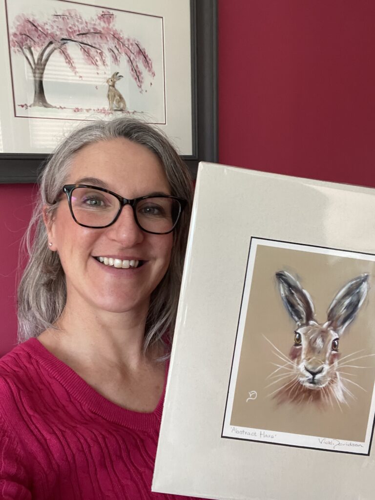 Artist Vicki Davidson with one of her prints