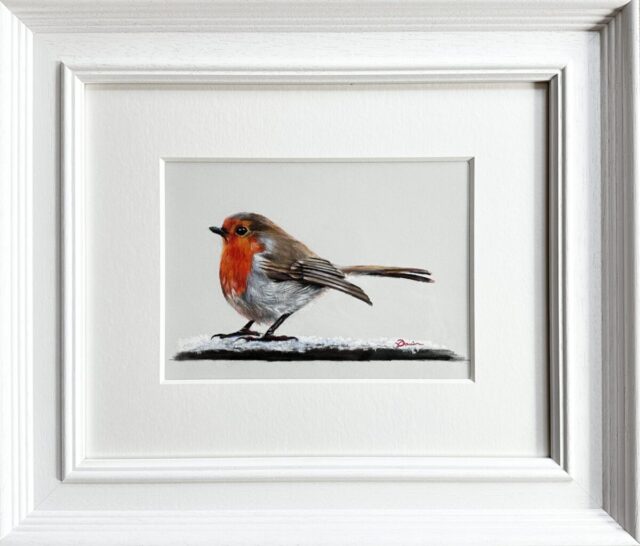 A coloured pencil drawing of a Robin in snow